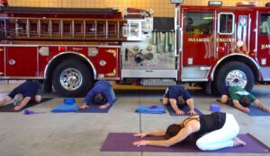 FireFlex yoga firefighters stretch in firehouse